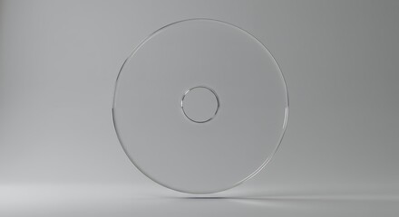 Poster - Transparent disc object stands on a reflective surface in a studio setting