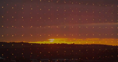 Poster - Sunset over hills with glowing square pattern animation in sky