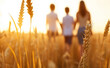 © Curioso.Photography - A family of three (father, mother, and child) walking hand-in-hand through a golden wheat field during sunset, creating a warm and peaceful atmosphere.