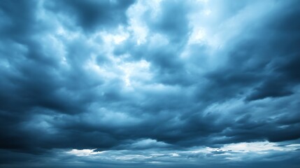 Poster - Dramatic cloud formation in a moody sky showcasing various shades of blue and gray during twilight hours : Generative AI