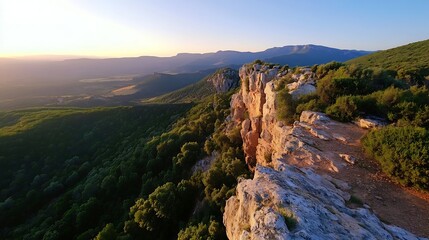 Aufkleber - Breathtaking View of Rocky Cliffside Overlooking Lush Green Valleys and Mountains at Sunset : Generative AI