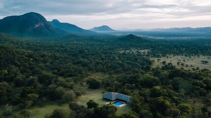 Aufkleber - Stunning aerial view of a modern house with a pool surrounded by lush greenery and distant mountain scenery : Generative AI