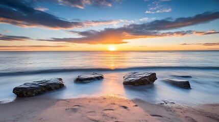 Aufkleber - Stunning sunset over a peaceful beach with rocks and gentle ocean waves : Generative AI