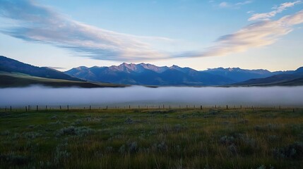 Leinwandbilder - Peaceful morning fog enveloping rolling hills and majestic mountains in the background at sunrise : Generative AI