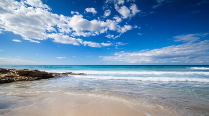 Aufkleber - Beautiful scenic view of a tranquil beach with soft waves and fluffy clouds under a bright blue sky : Generative AI