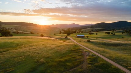 Aufkleber - Stunning sunset over a rolling landscape with a farmhouse and dirt road in the countryside : Generative AI