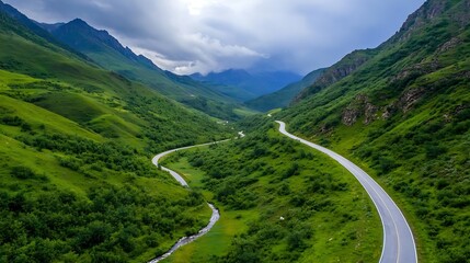 Poster - Winding road through lush green valley with mountains and dramatic cloudy sky above : Generative AI