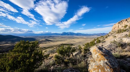Poster - Expansive panoramic view of mountains and valleys under a bright blue sky with dramatic clouds : Generative AI