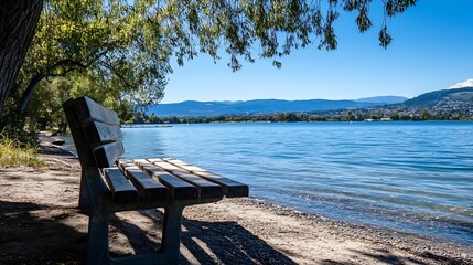 Aufkleber - Peaceful lakeside view featuring a solitary wooden bench under a tree with a stunning backdrop of clear blue water : Generative AI