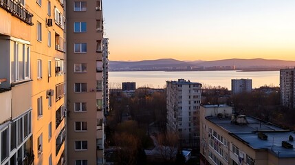 Poster - Scenic sunset view over tranquil waters near urban apartment buildings : Generative AI