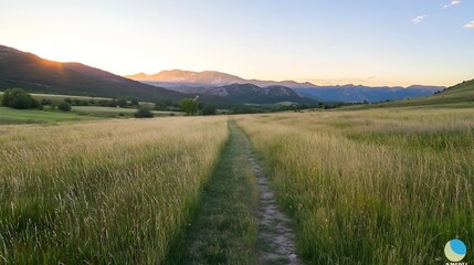 Aufkleber - Serene golden hour view of a winding path through grassy fields with mountains under a clear sky : Generative AI