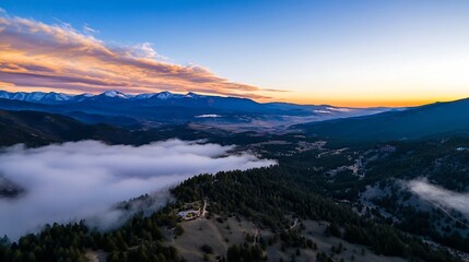 Aufkleber - Stunning aerial view of a valley covered in fog with majestic mountains in the background at sunrise : Generative AI