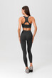 Fitness woman. Athletic girl on the gray background