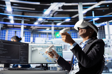 Poster - photovoltaics factory worker using vr headset to monitor performance of robot arms placing solar pan
