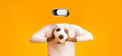 Leinwandbilder - A person enjoys a virtual reality experience while holding a soccer ball. The individual has no visible head, emphasizing the focus on technology and sports.