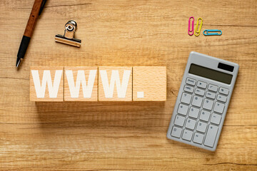 Poster - There is wood cube with the word WWW.. It is as an eye-catching image.