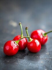 Poster - Fresh and vibrant red cherries arranged artistically on a dark wooden surface : Generative AI