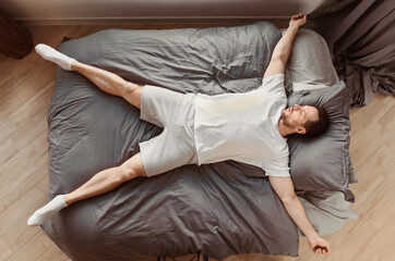 Aufkleber - Fast Asleep Man Sleeping Lying On His Back In Bed Resting At Home. Healthy Sleep Concept. Top View