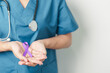 © Jo Panuwat D - Doctor holding purple Ribbon for Violence, Pancreatic, Esophageal, Testicular cancer, Alzheimer, epilepsy, lupus, Sarcoidosis and Fibromyalgia. Awareness month and World cancer day concept