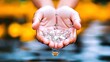 © Gina - Hands cupping water droplets
