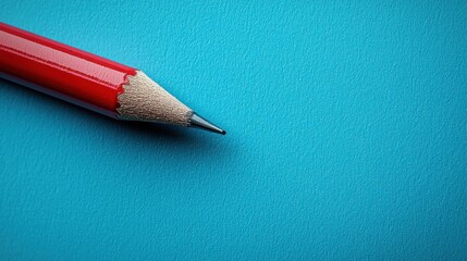 Poster - A simple pencil resting on a blue background representing competitive advantage messaging in creative work