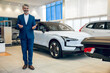 © zinkevych - Bearded salesman selling vehicle in the showroom