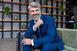 © zinkevych - Bearded caucasian well-dressed business man looking confident and determined