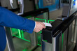© zinkevych - Close up picture of male hand with an access card on a security control