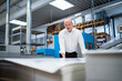 © Westend61 - Businessman in a printing plant checking product