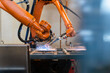 © Westend61 - Automatic robotic arms welding in industrial factory