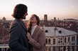 © Westend61 - Happy young couple on a balcony above the city of Venice, Italy