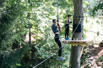 Wall Mural - enjoy thrilling zipline adventures in lush greenery and towering trees at this exciting adventure pa
