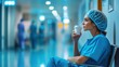 © Dace - Female surgeon drinking coffee during hospital break time