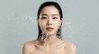 © Divid - East Asian woman splashing water on her face for a refreshing skincare and dermatology concept, focusing on hydration and skin barrier recovery. Beautiful Japanese or Korean woman washing her face