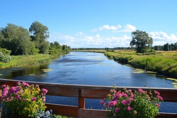 Poster - Peaceful river landscape with vibrant flowers and clear blue skies in summer