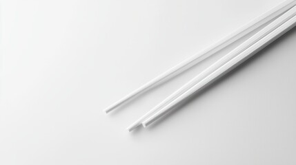 Poster - Minimalist Still Life of White Chopsticks on White Table High Angle Shot for Asian Food Cuisine Concept