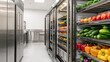 © นิพนธ์ บุญโปร่ง - commercial kitchen with stainless steel refrigerators and shelves filled with fresh vegetables like cucumbers, bell peppers, and broccoli, showcasing clean and organized environment