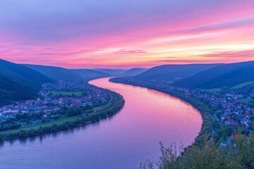 Aufkleber - Sunset over winding river with vibrant pink and purple hues reflecting on water in tranquil landscape