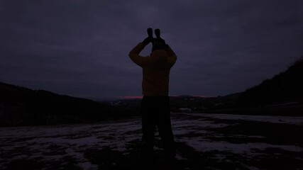 Wall Mural - amateur astronomer looking at the cloudy evening skies, expecting for observing planets, stars, moon