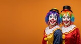 Colorful clowns with rainbow hair and red costumes against orange background
