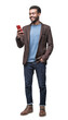 © kite_rin - Cheerful businessman looking at mobile phone isolated transparent PNG, Full length studio portrait of smiling young man with smartphone