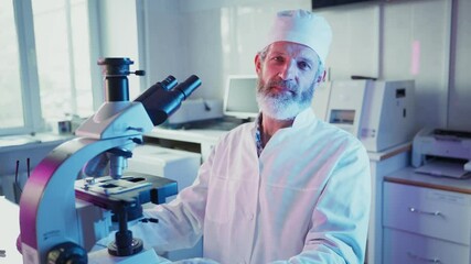 Wall Mural - professional laboratory technician carefully adjusting high precision microscope, engaging with came
