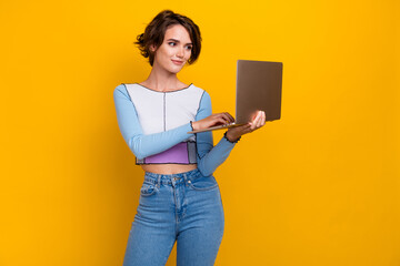 Aufkleber - Photo of nice positive young lady hold use wireless netbook eshopping isolated on yellow color background