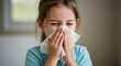 © Viktoriia Boiko - Sneezing caucasian female child blowing nose in tissue while unwell at home