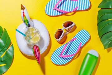 Poster - A vibrant summer vacation scene with flip flops, shades, and a floating flamingo