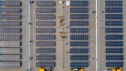 Aufkleber - An overhead shot of a sprawling site with workers assembling large solar panels the layout revealing the systematic approach to sustainable energy infrastructures.