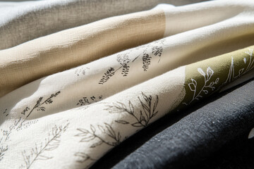 Poster - Textile Textures: A close-up view of artful textile fabrics, soft light delicately falls across their surfaces, revealing patterns, textures, and designs.