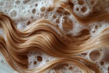 Close-up of blonde hair being washed with shampoo in a bathtub, with bubbles and foam on top of the long, straight hair against a green background