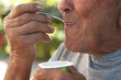 © carballo - mouth of an elderly man eating yogurt