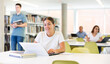 © JackF - Smart female American student preparing for the exam in the school library
